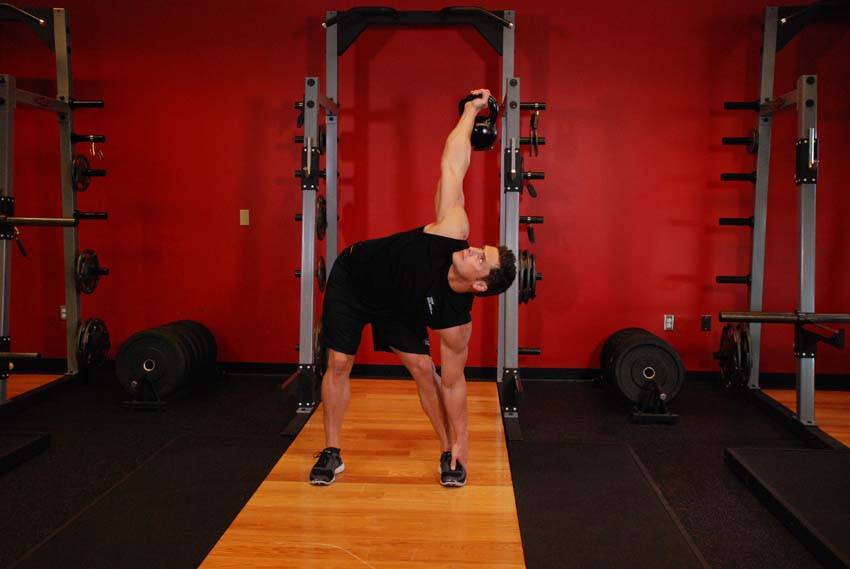 Kettlebell Windmill — end position, working the abs