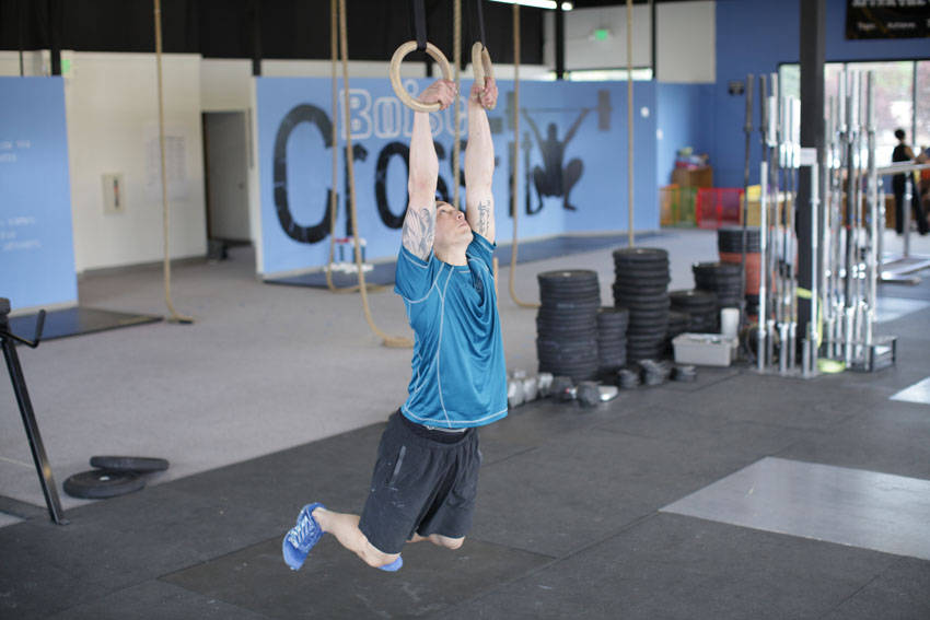 Kipping Muscle Up — starting position, working the lats