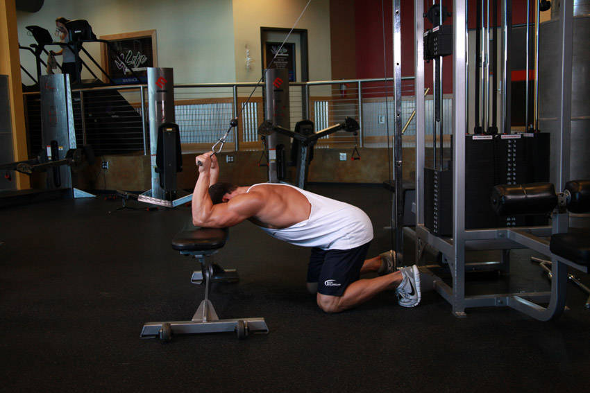 Kneeling Cable Triceps Extension — starting position, working the triceps