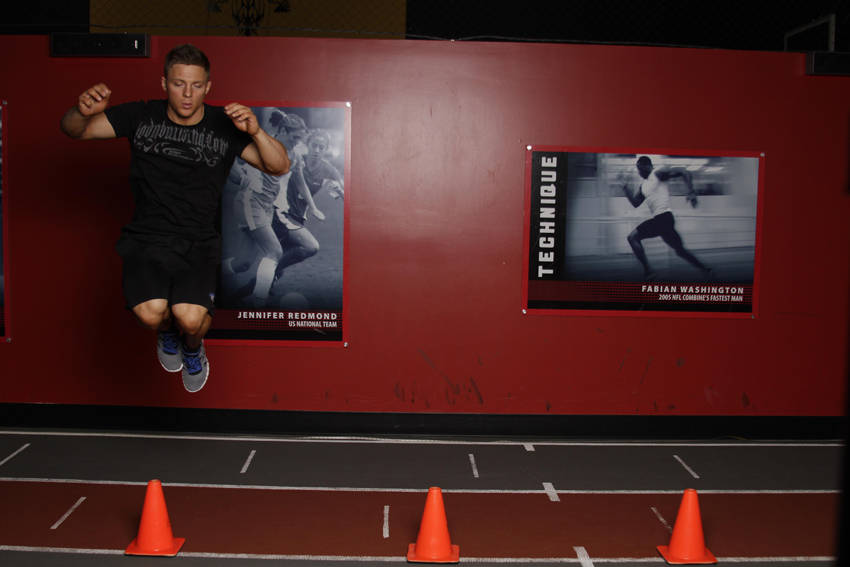 Lateral Cone Hops — end position, working the adductors