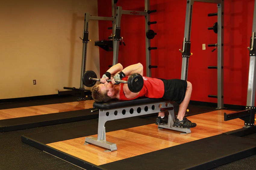 Lying Close-Grip Barbell Triceps Press To Chin — end position, working the triceps