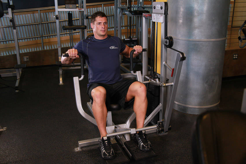 Machine Bench Press — starting position, working the chest