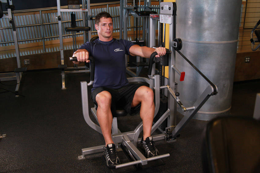 Machine Bench Press — end position, working the chest