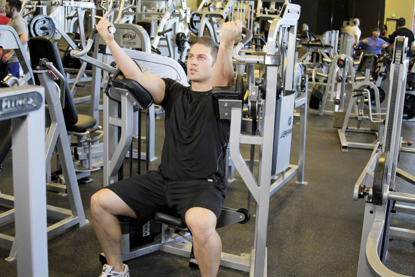 Machine Bicep Curl — starting position, working the biceps