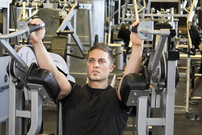Machine Triceps Extension — end position, working the triceps