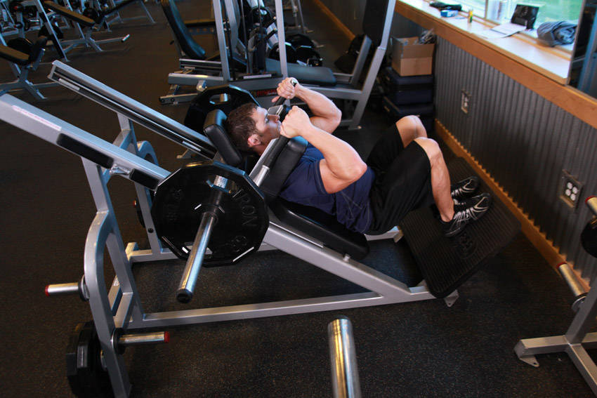 Narrow Stance Hack Squats — starting position, working the quads