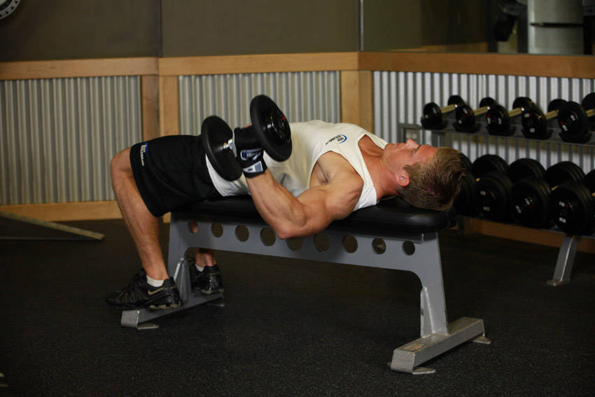 One-Arm Flat Bench Dumbbell Flye — starting position, working the chest