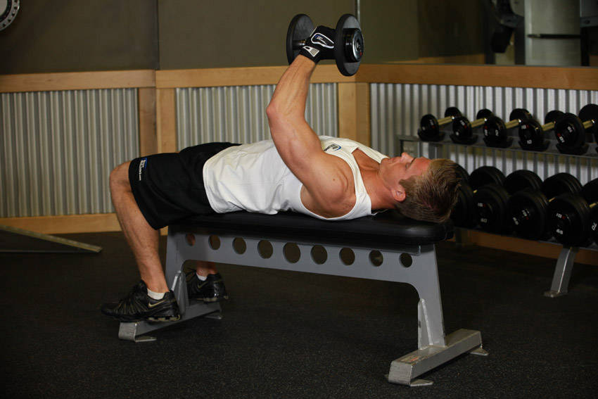 One-Arm Flat Bench Dumbbell Flye — end position, working the chest