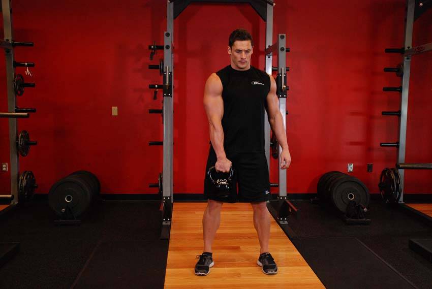 One-Arm Kettlebell Split Snatch — starting position, working the shoulders