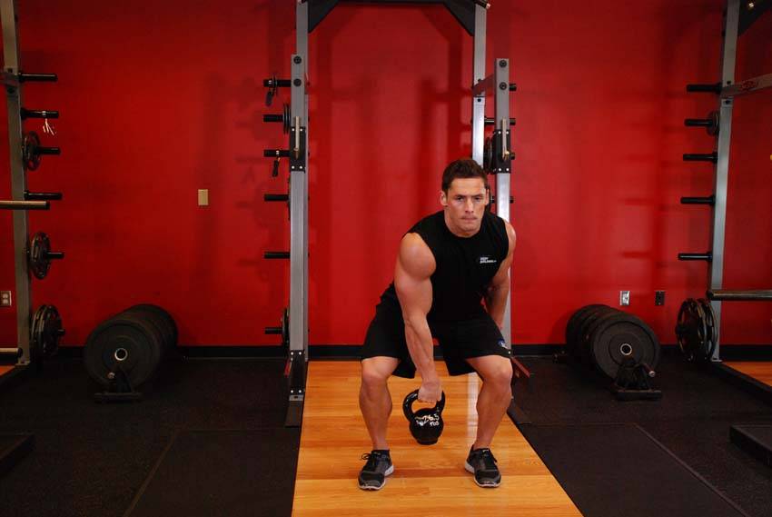 One-Arm Kettlebell Split Snatch — end position, working the shoulders