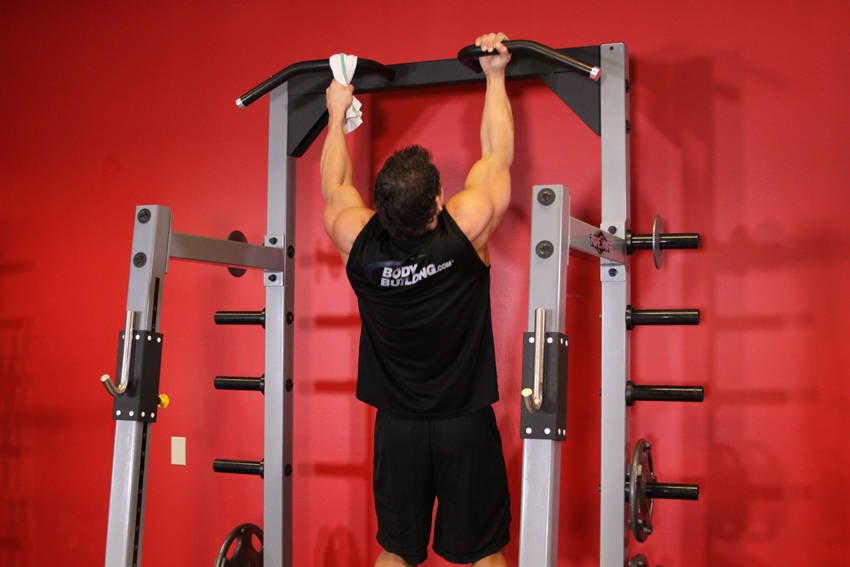 One Arm Chin-Up — starting position, working the middle back