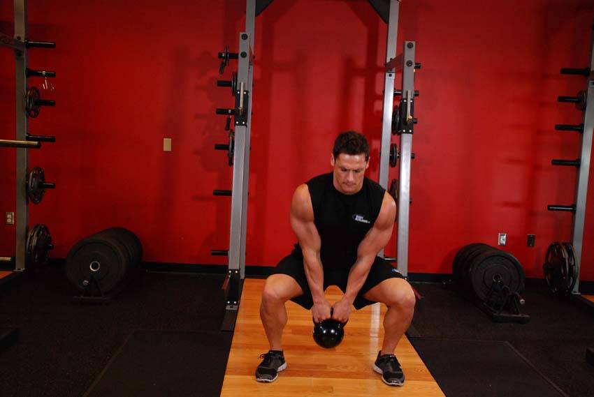 Open Palm Kettlebell Clean — starting position, working the hamstrings