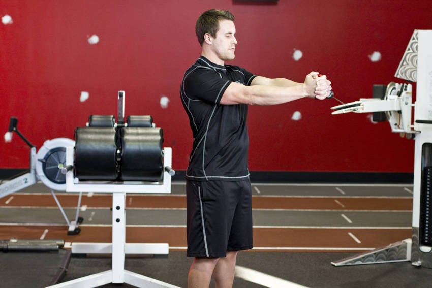 Pallof Press With Rotation — end position, working the abs