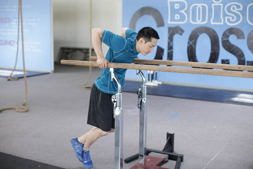 Parallel Bar Dip — starting position, working the triceps