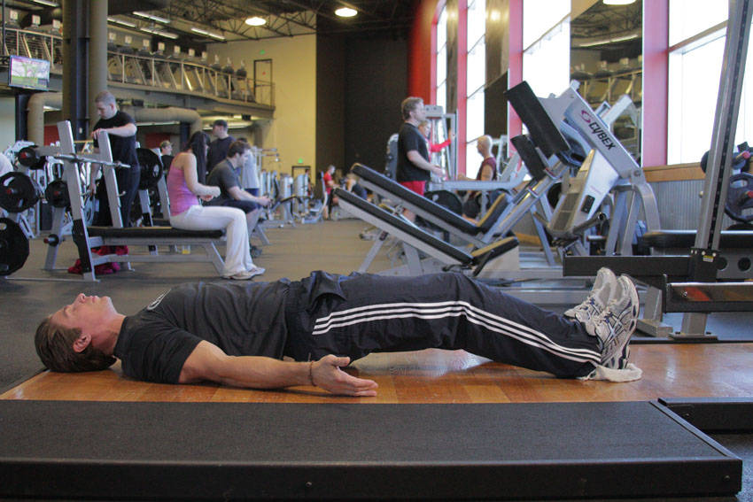 Platform Hamstring Slides — starting position, working the hamstrings