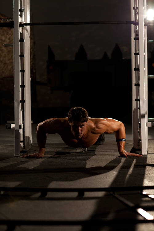 Push-Up Wide — end position, working the chest