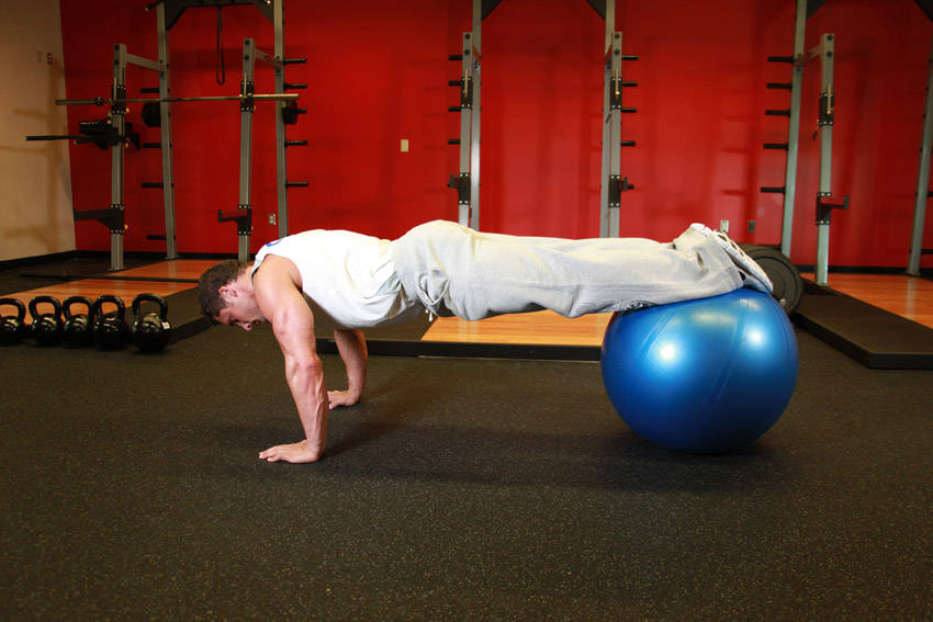 Push-Ups With Feet On An Exercise Ball — end position, working the chest