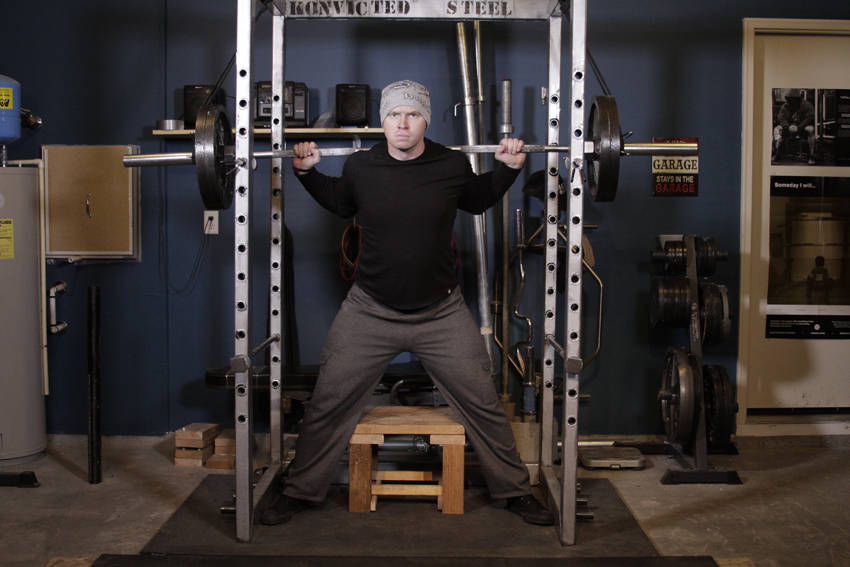 Reverse Band Box Squat — starting position, working the quads