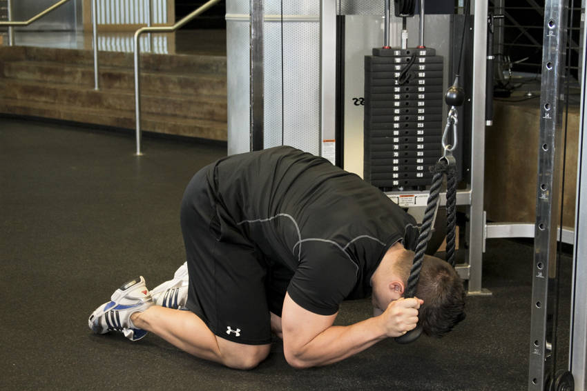 Rope Crunch — end position, working the abs