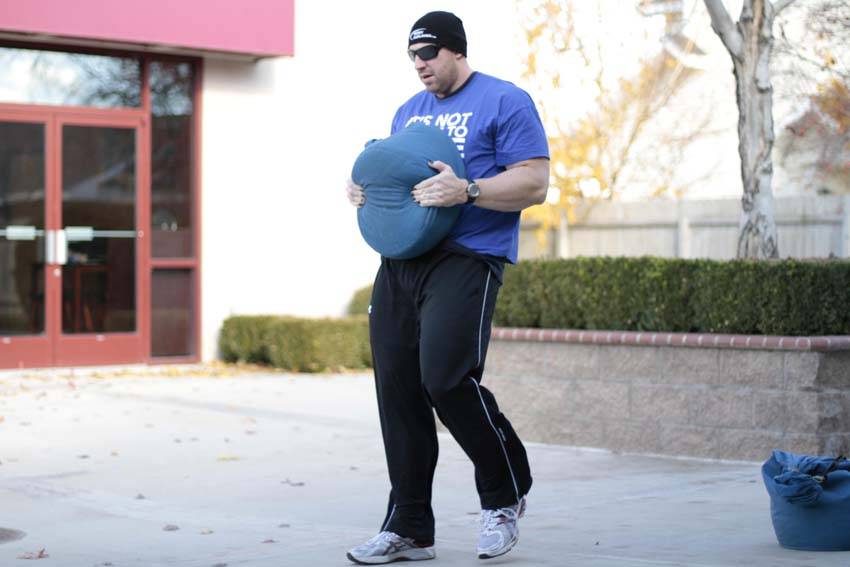 Sandbag Load — end position, working the quads