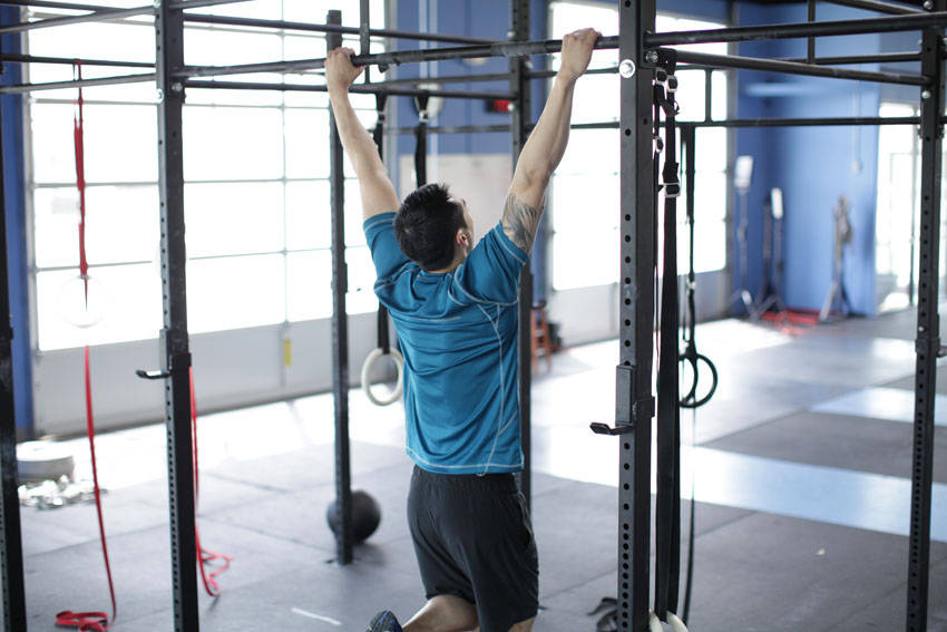 Scapular Pull-Up — starting position, working the traps