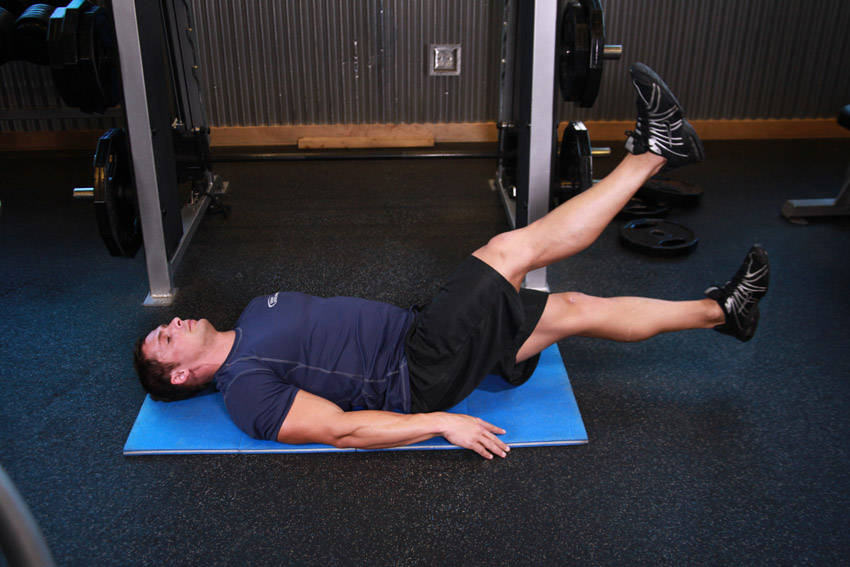 Scissor Kick — end position, working the abs