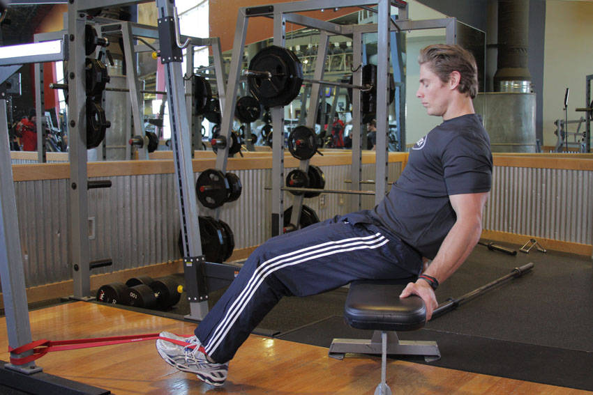 Seated Band Hamstring Curl — starting position, working the hamstrings