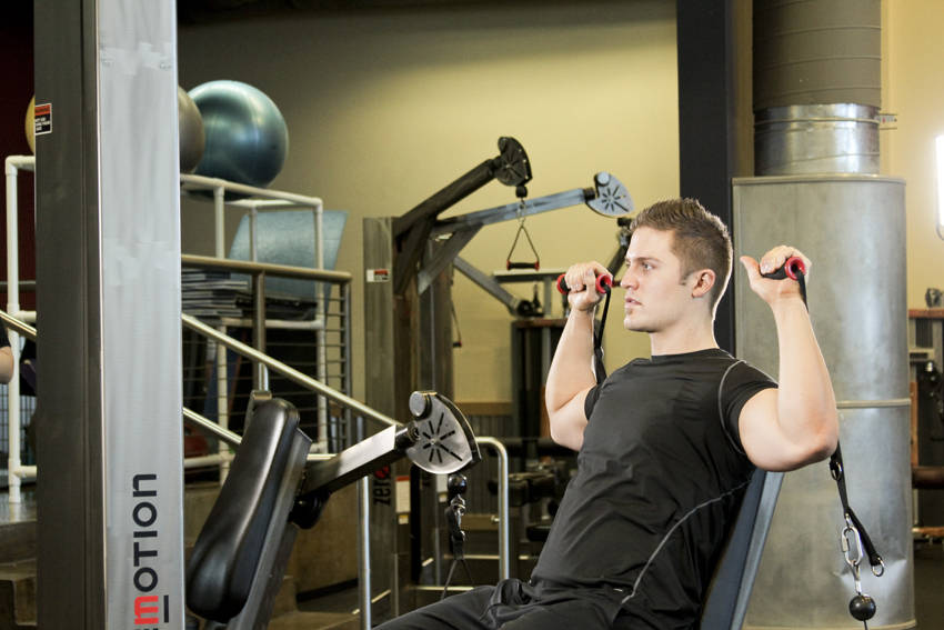 Seated Cable Shoulder Press — starting position, working the shoulders