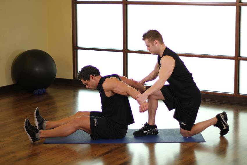 Seated Front Deltoid — starting position, working the shoulders