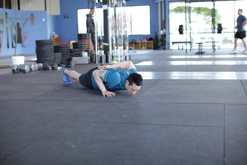 Single-Arm Push-Up — starting position, working the chest