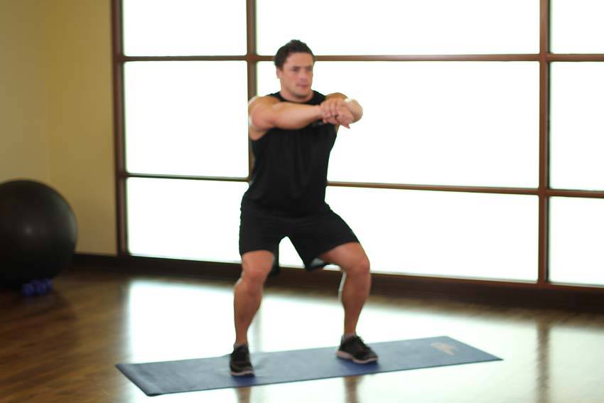 Sit Squats — end position, working the quads