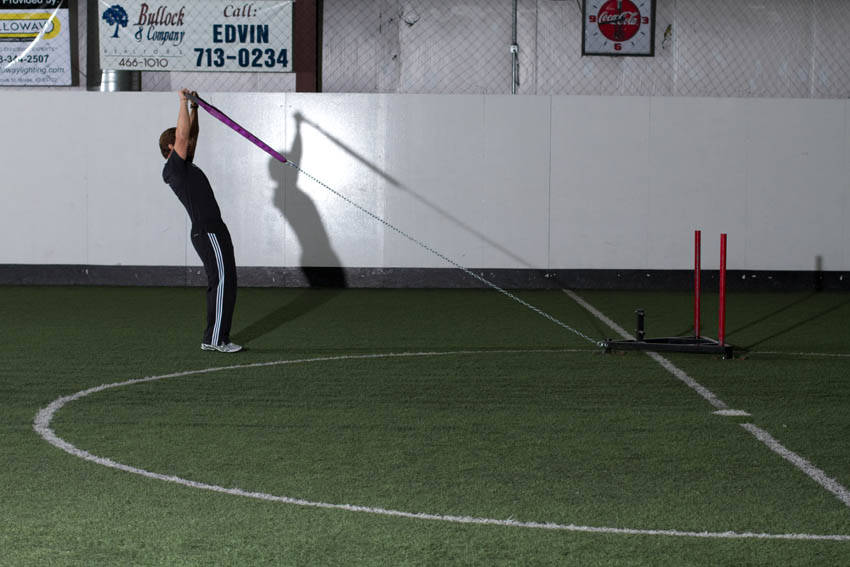 Sled Overhead Backward Walk — end position, working the shoulders
