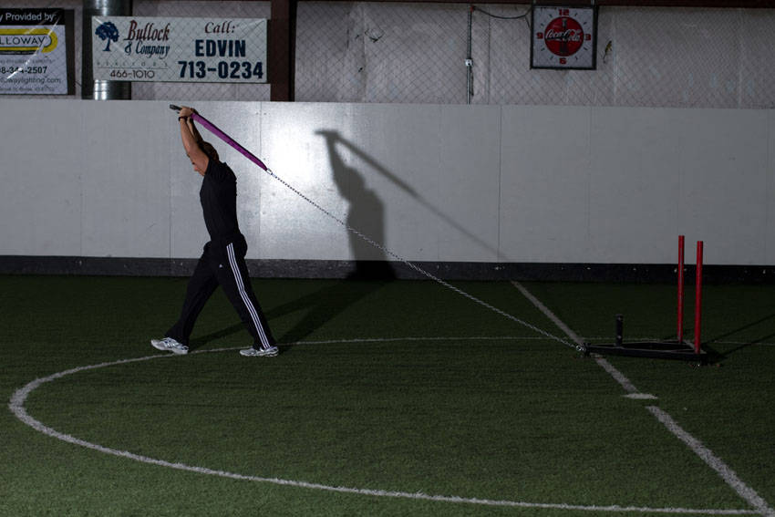 Sled Overhead Triceps Extension — end position, working the triceps