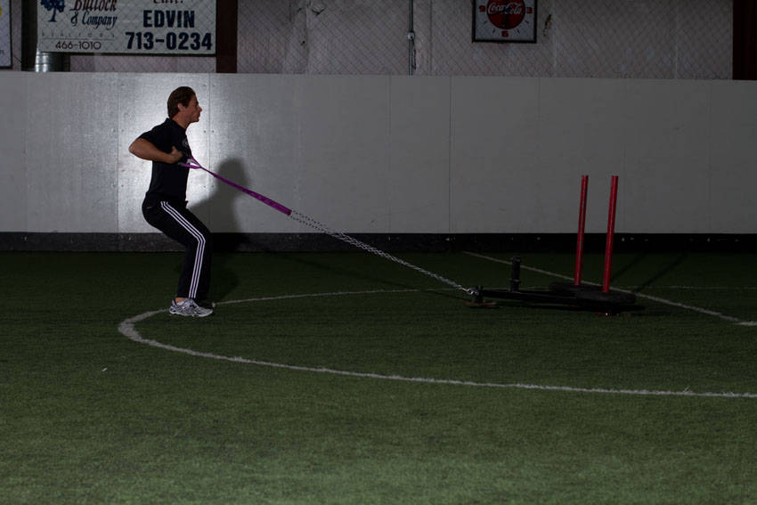 Sled Row — end position, working the middle back