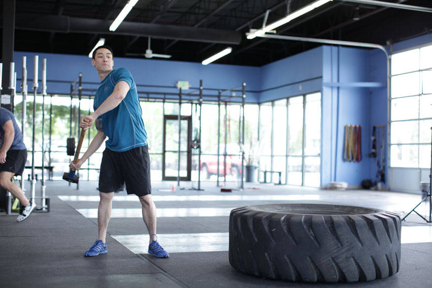 Sledgehammer Swings — starting position, working the abs