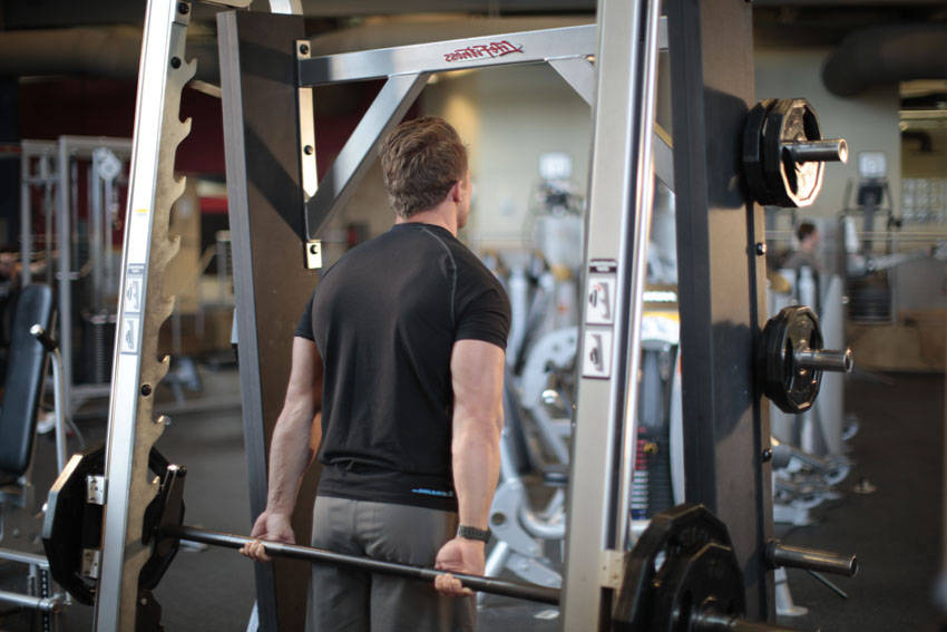 Smith Machine Behind the Back Shrug — starting position, working the traps