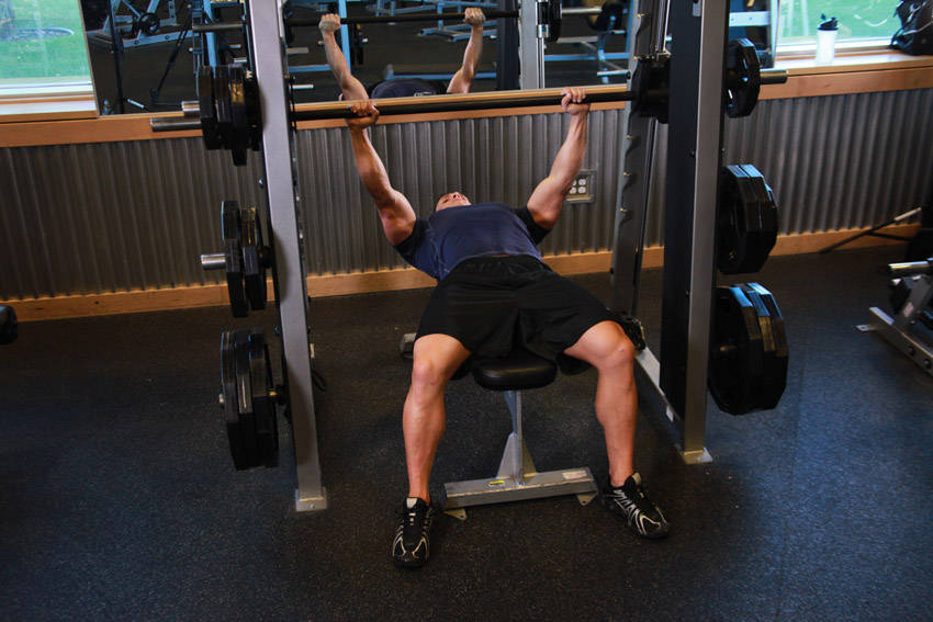 Smith Machine Bench Press — end position, working the chest