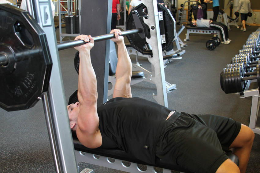 Smith Machine Close-Grip Bench Press — end position, working the triceps