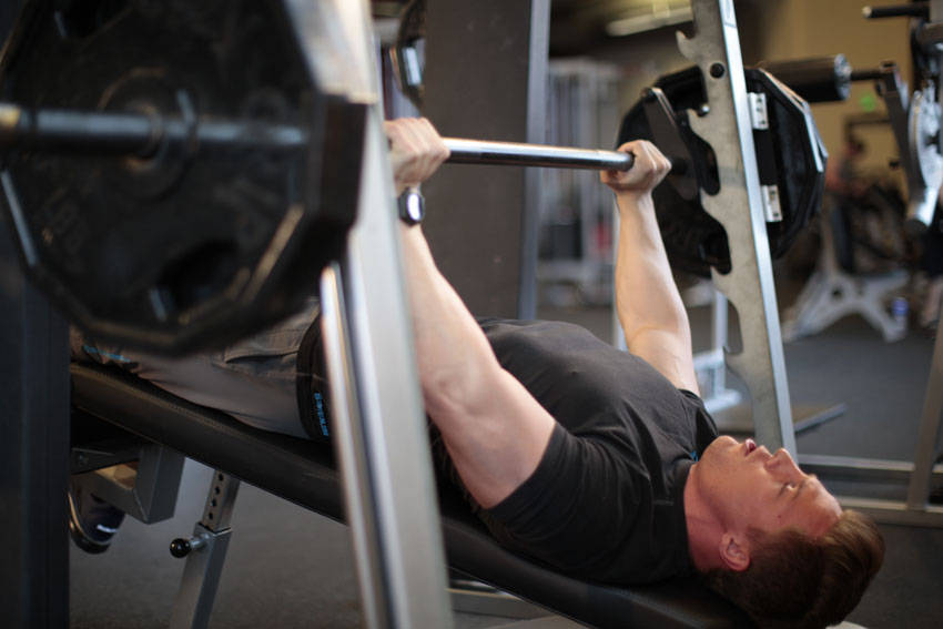 Smith Machine Decline Press — end position, working the chest