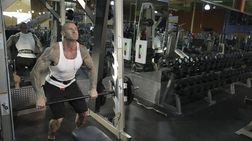 Smith Machine Hang Power Clean — end position, working the hamstrings