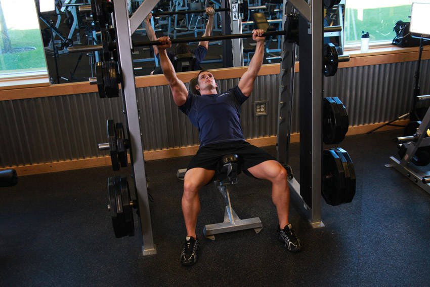 Smith Machine Incline Bench Press — end position, working the chest