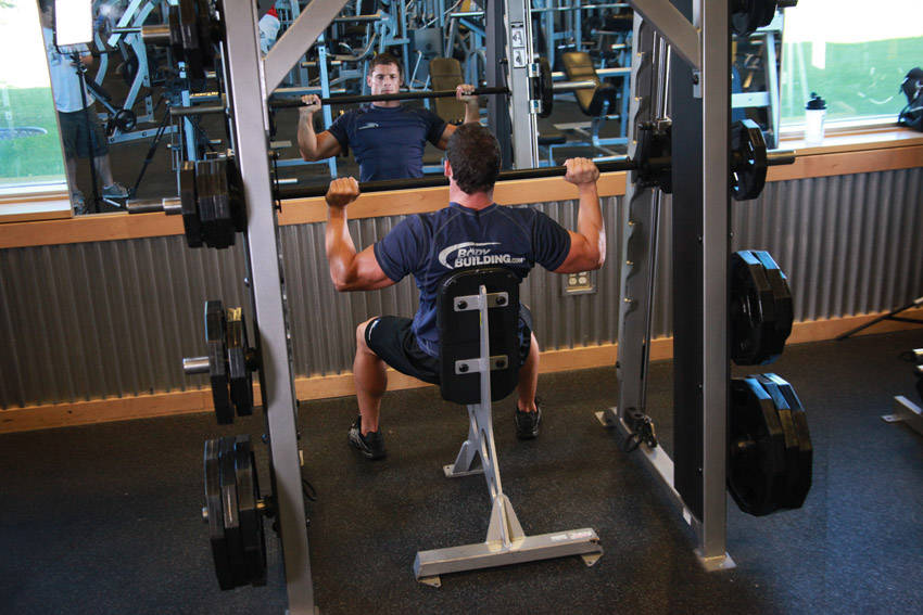 Smith Machine Overhead Shoulder Press — starting position, working the shoulders