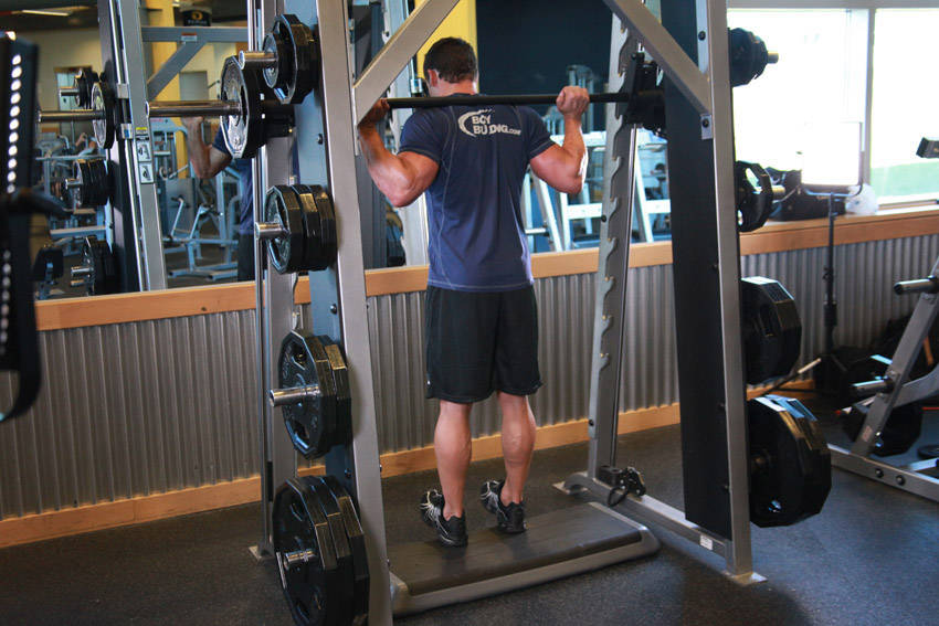 Smith Machine Reverse Calf Raises — starting position, working the calves