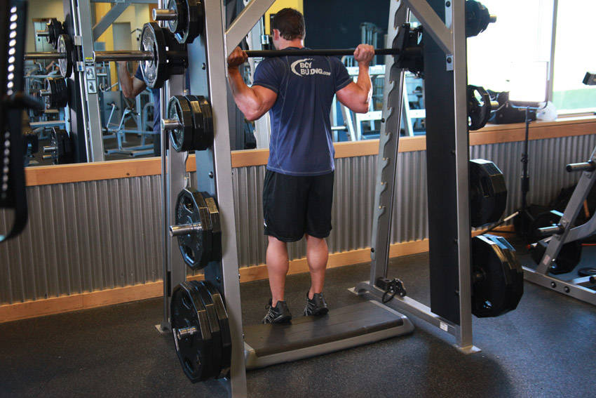 Smith Machine Reverse Calf Raises — end position, working the calves