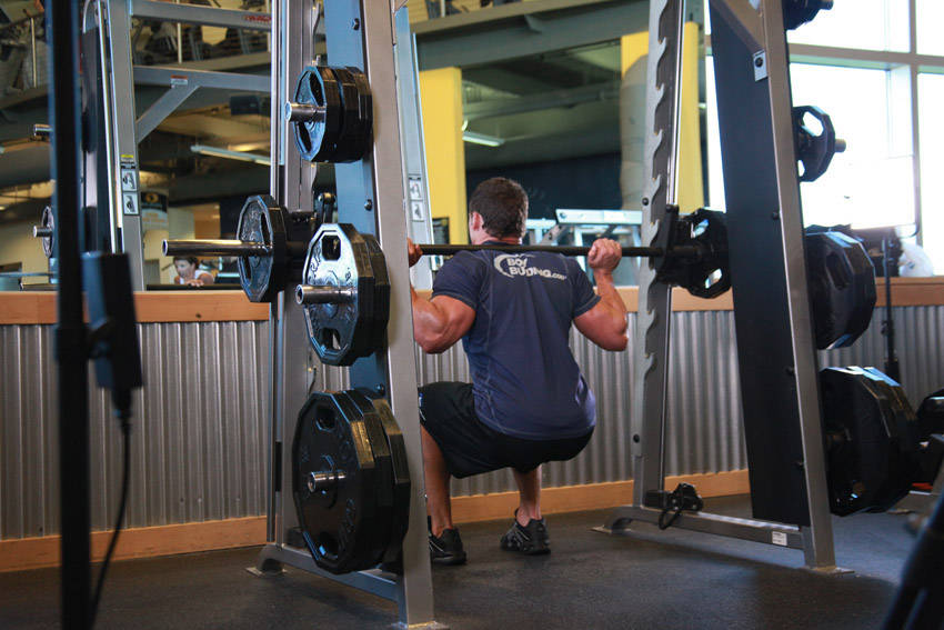 Smith Machine Squat — starting position, working the quads