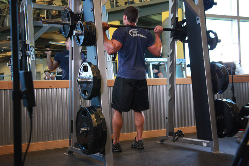 Smith Machine Squat — end position, working the quads