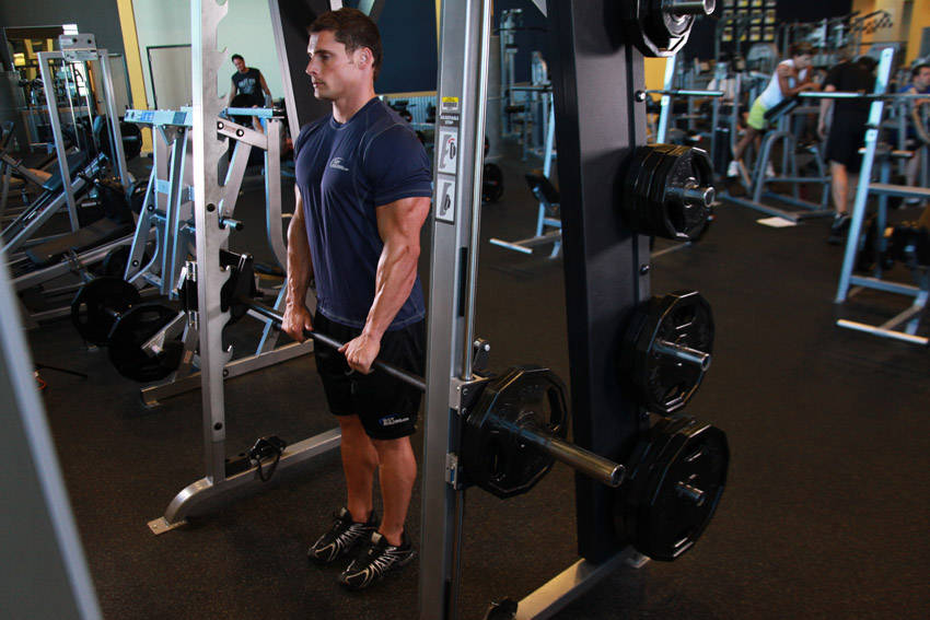 Smith Machine Upright Row — starting position, working the traps