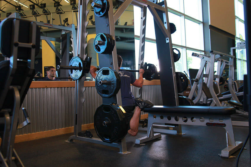 Smith Single-Leg Split Squat — end position, working the quads