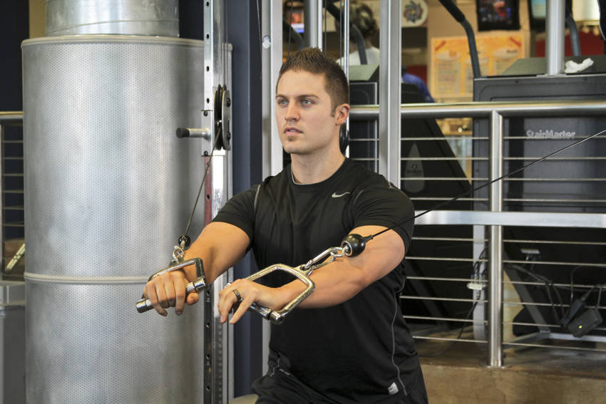 Standing Cable Chest Press — end position, working the chest