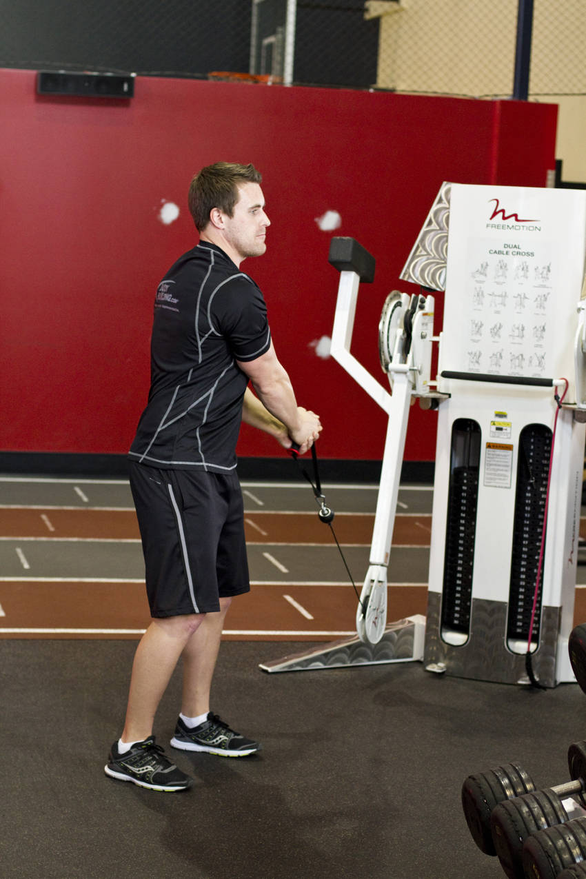 Standing Cable Lift — starting position, working the abs